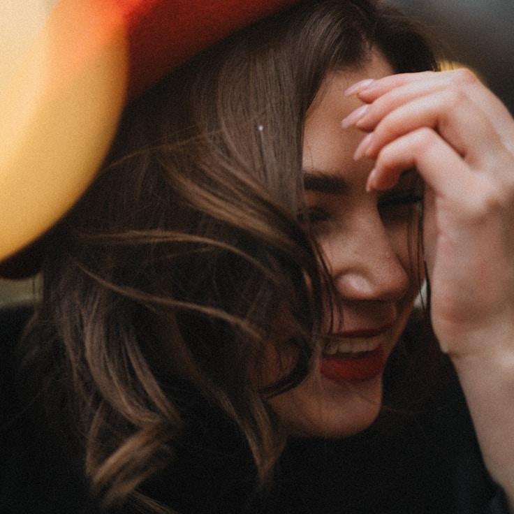 Kaveri Mehta, Lead Design Curator at Global Data Systems, reviewing corporate floral arrangements